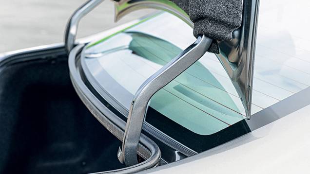 No LXS, alças sem revestimento do porta-malas | <a href="https://preprod.quatrorodas.abril.com.br/carros/testes/honda-civic-2014-735270.shtml" rel="migration">Leia mais</a> No LXS, alças sem revestimento do porta-malas | <a href="https://preprod.quatrorodas.abril.com.br/carros/testes/honda-civic-2014-735270.shtml" rel="migration">Leia mais</a>
