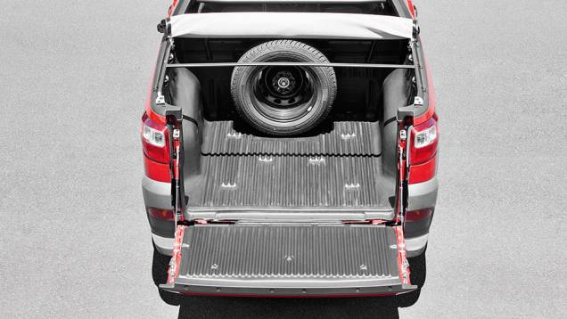 Caçamba curta: 680 litros ou 650 kg | <a href="https://preprod.quatrorodas.abril.com.br/carros/impressoes/fiat-strada-working-1-4-764158.shtml" rel="migration">Leia mais</a> Caçamba curta: 680 litros ou 650 kg | <a href="https://preprod.quatrorodas.abril.com.br/carros/impressoes/fiat-strada-working-1-4-764158.shtml" rel="migration">Leia mais</a>
