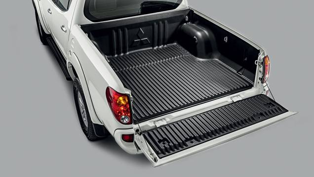 A capacidade de carga é de 1 095 kg. | <a href="https://preprod.quatrorodas.abril.com.br/carros/testes/mitsubishi-l200-triton-764187.shtml" rel="migration">Leia mais</a> A capacidade de carga é de 1 095 kg. | <a href="https://preprod.quatrorodas.abril.com.br/carros/testes/mitsubishi-l200-triton-764187.shtml" rel="migration">Leia mais</a>