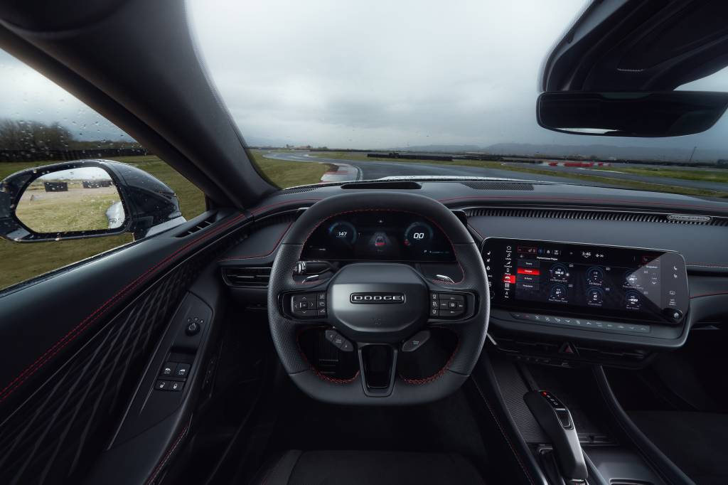 The steering wheel of the Dodge Charger is performance oriented The steering wheel of the Dodge Charger is performance oriented and technical in feel, with a heated flat top/flat bottom design, and includes paddle shifters to manage regenerative braking and a PowerShot button — located on the front of the wheel for quick access — for the Charger Daytona Scat Pack and R/T.