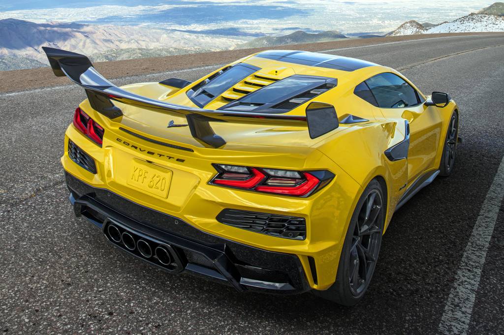 Chevrolet Corvette ZR1 Coupe Rear 3/4 view of a Chevrolet Corvette ZR1 Coupe with ZTK Performance Package, highlighting the split-window rear hatch, driving down a mountain road. Preproduction model shown. Actual production model may vary.