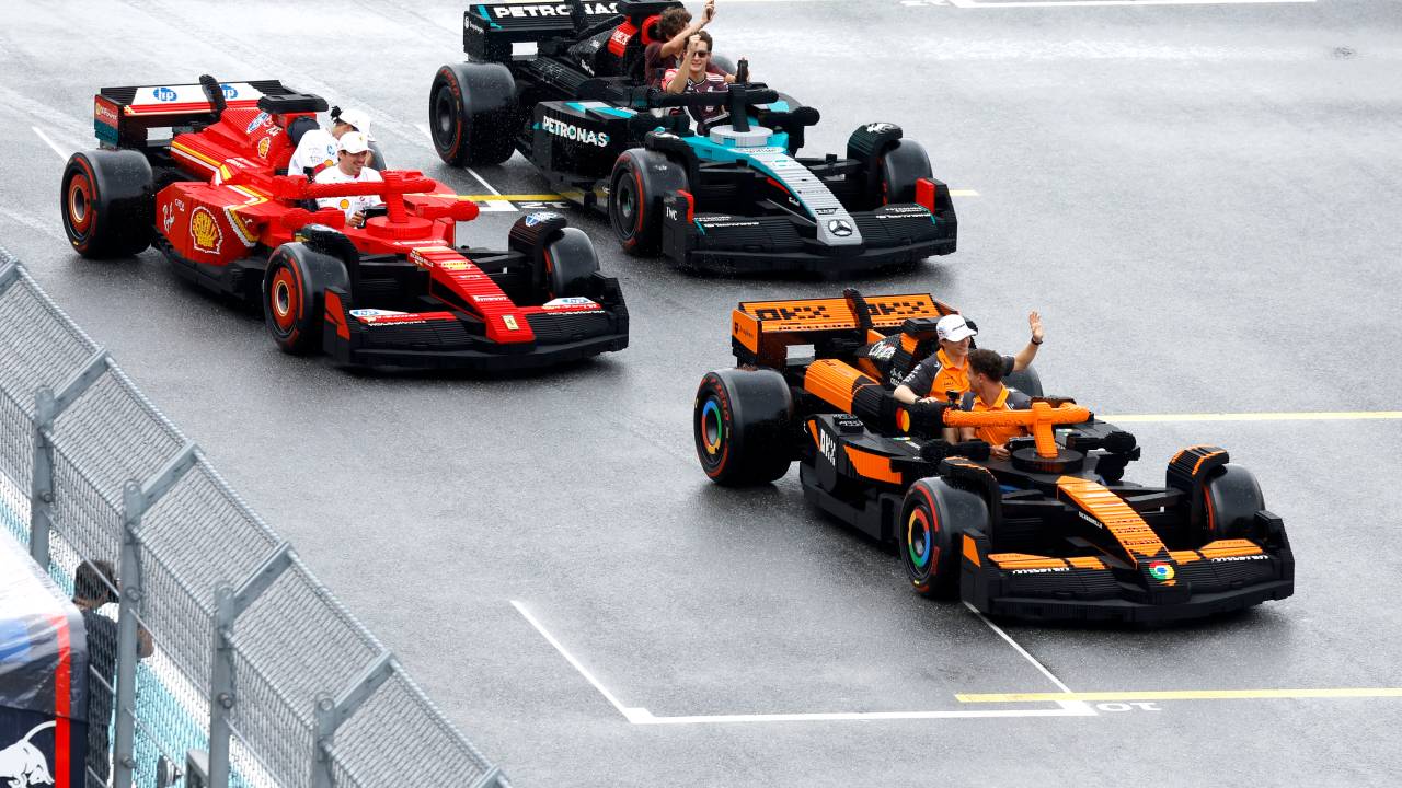 MIAMI, FLORIDA - MAY 04: Charles Leclerc of Monaco and Scuderia Ferrari, Lewis Hamilton of Great Britain and Scuderia Ferrari, George Russell of Great Britain and Mercedes AMG Petronas F1 Team, Andrea Kimi Antonelli of Italy and Mercedes AMG Petronas F1 Team, Lando Norris of Great Britain and McLaren, and Oscar Piastri of Australia and McLaren race LEGO cars on the drivers parade during the F1 Grand Prix of Miami at Miami International Autodrome on May 04, 2025 in Miami, Florida. (Photo by Glenn Dunbar/Getty Images for LEGO Group)