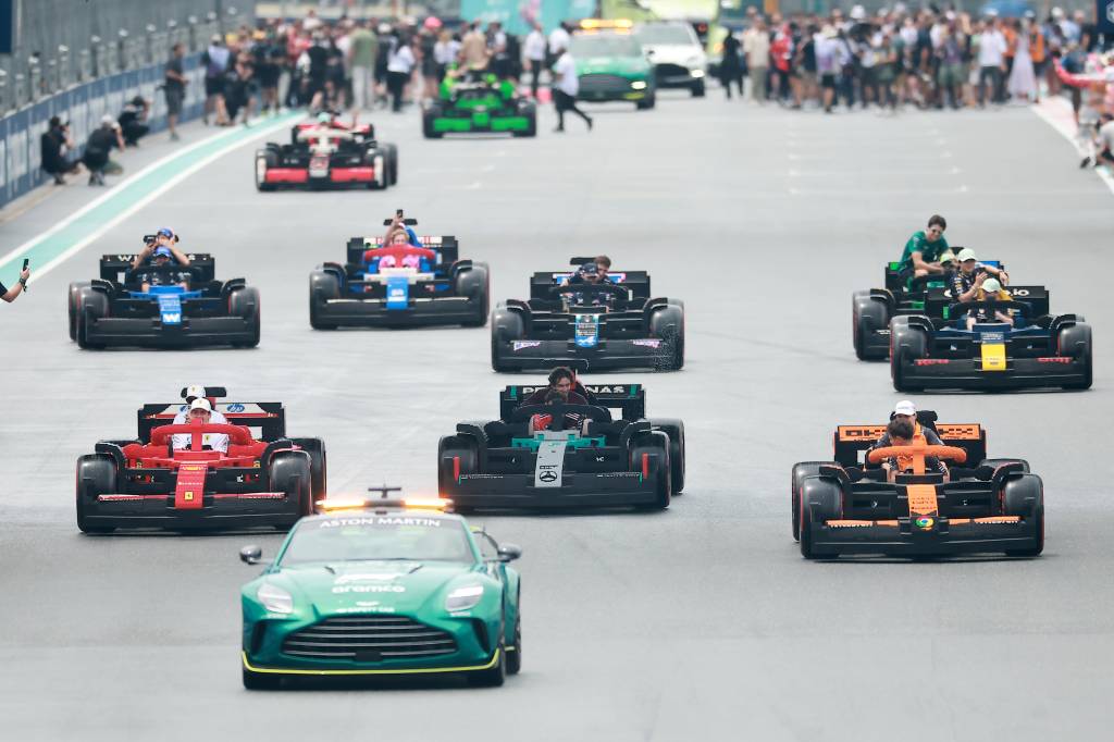 LEGO Group at F1 Grand Prix of Miami MIAMI, FLORIDA - MAY 04: Charles Leclerc of Monaco and Scuderia Ferrari, Lewis Hamilton of Great Britain and Scuderia Ferrari, George Russell of Great Britain and Mercedes AMG Petronas F1 Team, Andrea Kimi Antonelli of Italy and Mercedes AMG Petronas F1 Team, Lando Norris of Great Britain and McLaren, and Oscar Piastri of Australia and McLaren drive LEGO cars on the drivers parade during the F1 Grand Prix of Miami at Miami International Autodrome on May 04, 2025 in Miami, Florida. (Photo by Hector Vivas/Getty Images for LEGO Group)